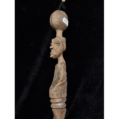 273 - A fascinating and greatly detailed hand carved antique African tribal walking stick.  From the Hallw... 