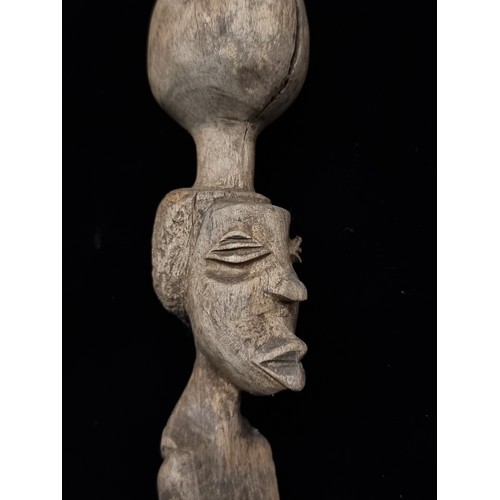 273 - A fascinating and greatly detailed hand carved antique African tribal walking stick.  From the Hallw... 