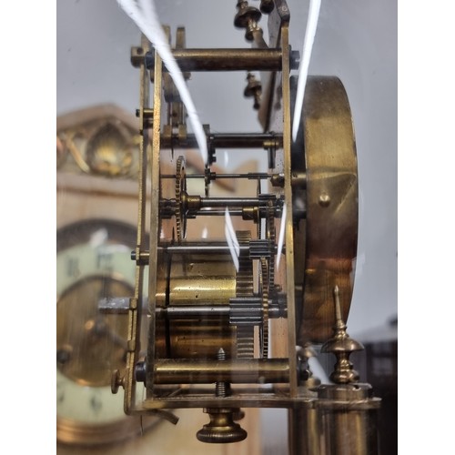 276 - A wonderful antique brass torsion pendulum anniversary clock, housed under a glass dome with a stepp... 