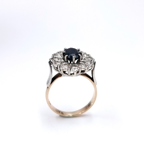 1108 - Star Lot : A Lovely large vintage Sapphire and gemset flower ring, 2 carat Sapphire with a large rou... 