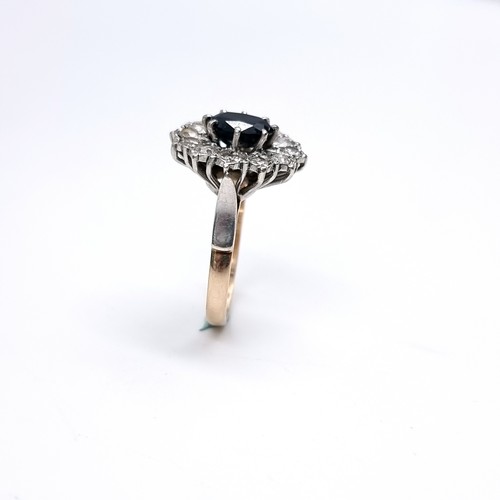 1108 - Star Lot : A Lovely large vintage Sapphire and gemset flower ring, 2 carat Sapphire with a large rou... 