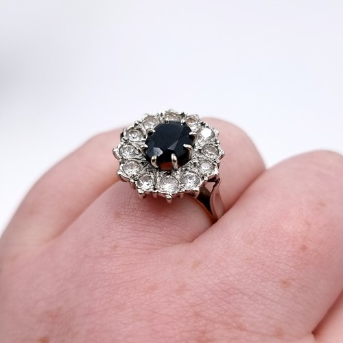 1108 - Star Lot : A Lovely large vintage Sapphire and gemset flower ring, 2 carat Sapphire with a large rou... 