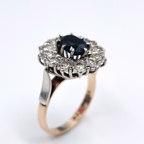 1108 - Star Lot : A Lovely large vintage Sapphire and gemset flower ring, 2 carat Sapphire with a large rou... 