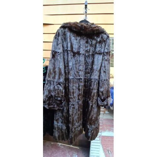 374 - Star lot : A stunning vintage genuine fur longline coat. Approx. size medium.