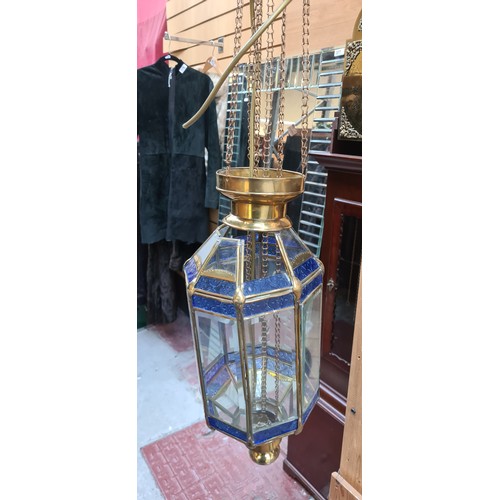 380 - A fab pair of hanging lantern style light fixtures made of brass and bevelled clear glass panels, al... 