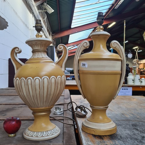 388 - A pair of large traditional urn shaped ceramic table lamps in a bright yellow tone. We will fix the ... 