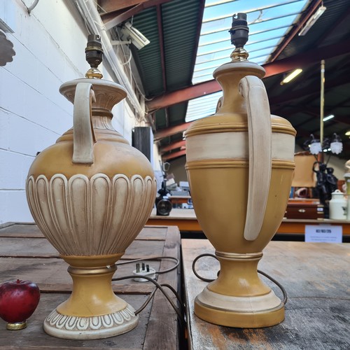 388 - A pair of large traditional urn shaped ceramic table lamps in a bright yellow tone. We will fix the ... 