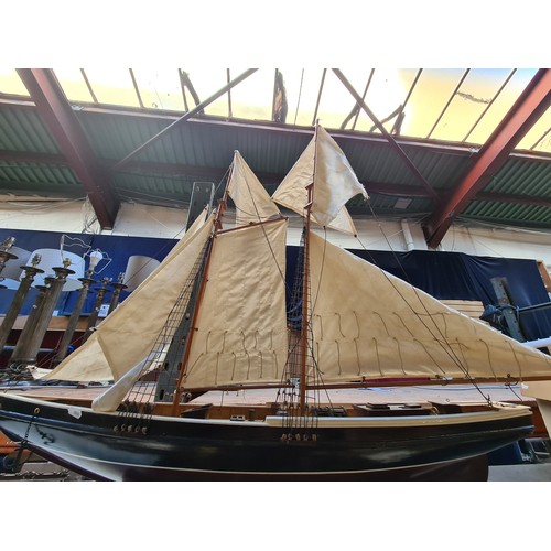 445 - Star Lot : A very large 5 cotton sail Wooden model of a schooner ship, complete with detailed riggin... 