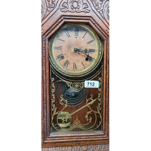 712 - An eight day spring strike Waterbury Festus gingerbread mantel clock with pendulum. Would make a gre... 