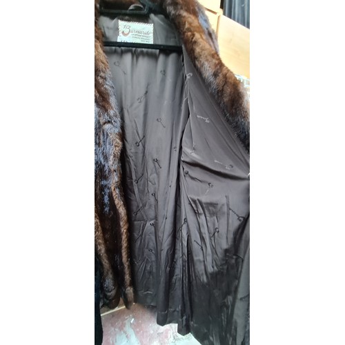 373 - Star lot : A beautiful vintage Barnardo Dublin genuine fur longline coat in brown. Size approx. medi... 