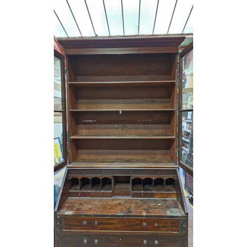 984 - Star lot ;An antique writing desk with added display glass cabinet, features four drawers and writin... 