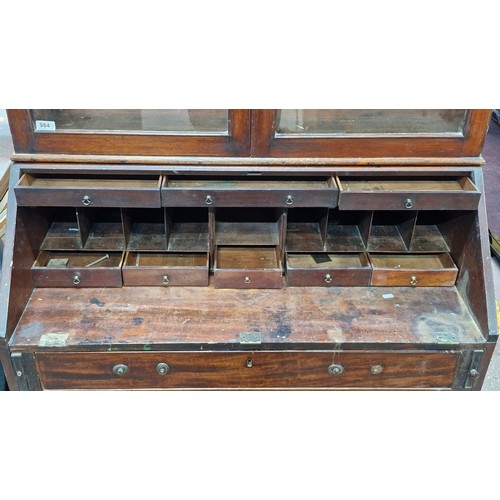 984 - Star lot ;An antique writing desk with added display glass cabinet, features four drawers and writin... 