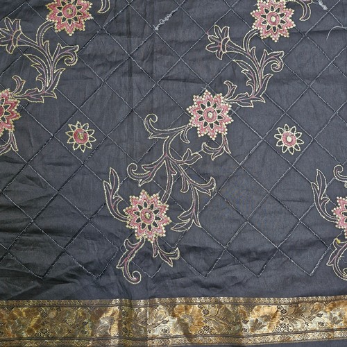 1020 - An elegant silk Indian Saree. Features intricate detailing with floral pattern and gilt brocade work... 