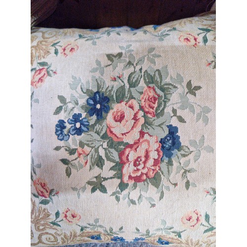 1035 - Three items. Includes two rolls of fabric. Features floral prints. Along with a vintage cushion. All... 