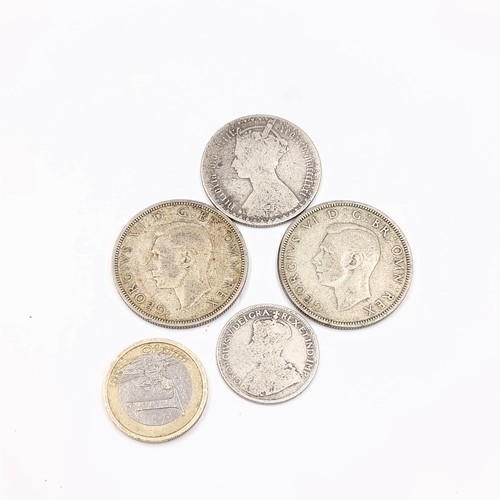 710 - Four British pre 1947 coins all with silver content.