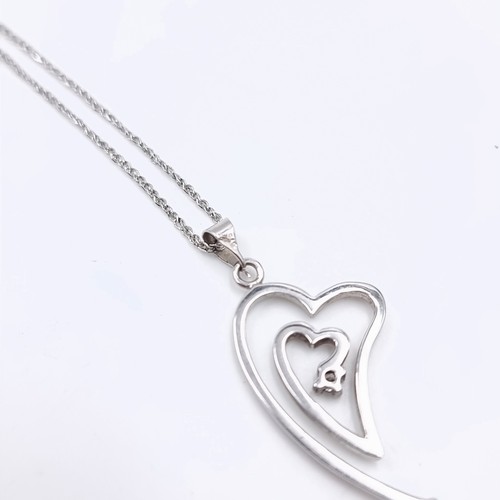 1099 - Star lot : A very pretty 9ct white gold and diamond pendent necklace. chain length 40cm 2.9 grams