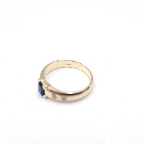 5 - Star Lot : A  super 14 carat gold diamond and sapphire ring. Ring size - L 1/2. Weight - 3.28 grams.