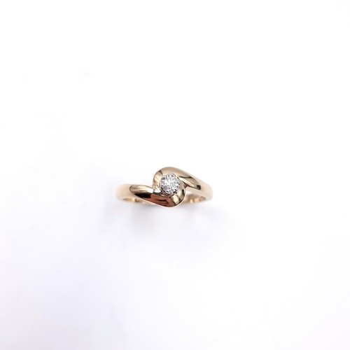 10 - A nine carat gold solitaire diamond ring. Size - M. Weight - 3.1 grams.