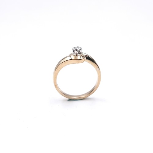 10 - A nine carat gold solitaire diamond ring. Size - M. Weight - 3.1 grams.