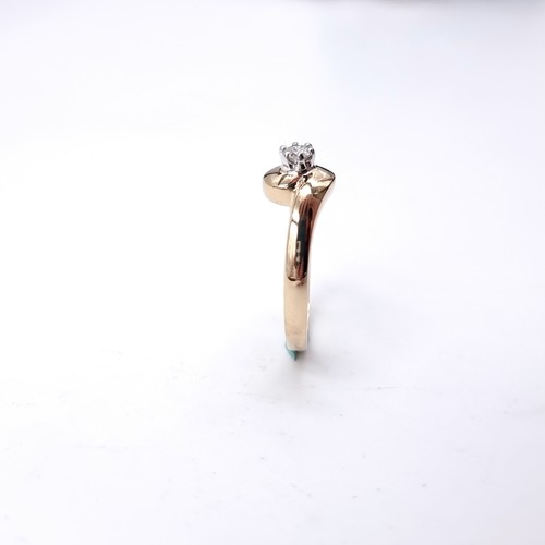 10 - A nine carat gold solitaire diamond ring. Size - M. Weight - 3.1 grams.