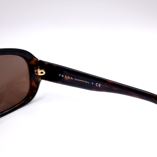 13 - A pair of Genuine designer Prada faux tortoise shell framed sunglasses in good condition with serial... 