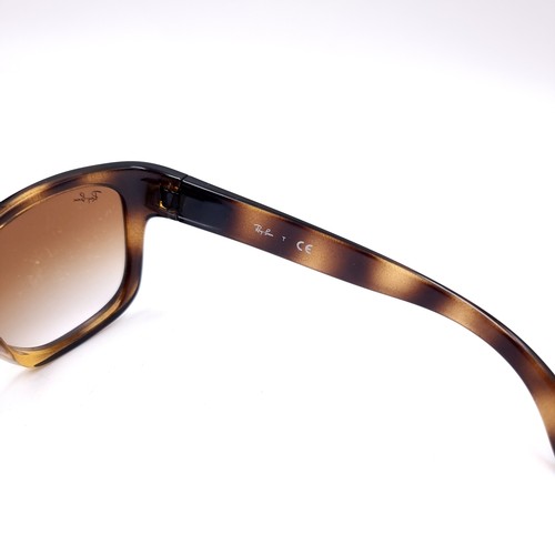 14 - A pair of Ray-Ban sunglasses set in faux tortoise shell frames with serial no.s to frames.