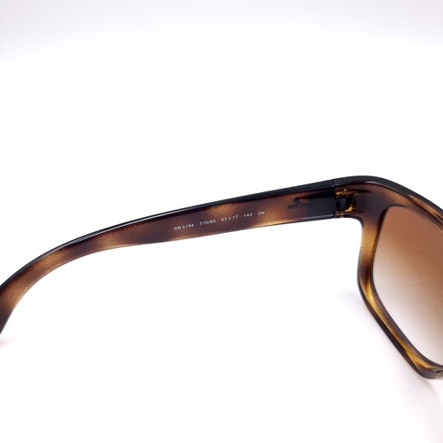 14 - A pair of Ray-Ban sunglasses set in faux tortoise shell frames with serial no.s to frames.