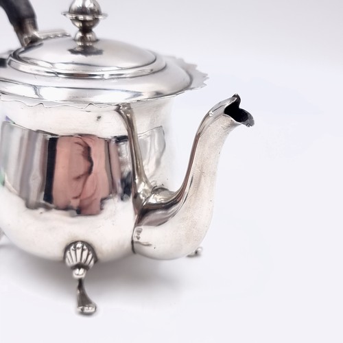 541 - Star Lot : A  super bachelor sterling silver teapot standing on four paw feet with finial mount and ... 