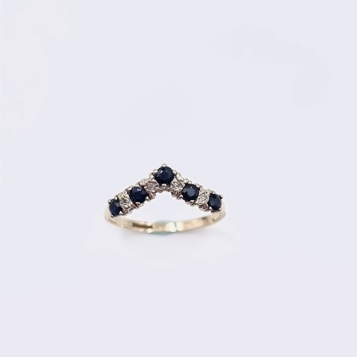 577 - Star Lot : A nine carat gold wishbone diamond and sapphire half eternity ring. Ring size - O. Weight... 