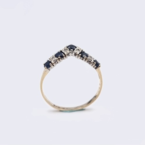 577 - Star Lot : A nine carat gold wishbone diamond and sapphire half eternity ring. Ring size - O. Weight... 