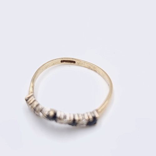 577 - Star Lot : A nine carat gold wishbone diamond and sapphire half eternity ring. Ring size - O. Weight... 