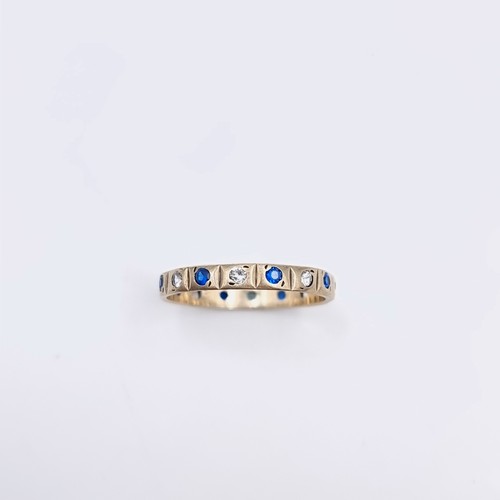 578 - Star Lot : A nine carat gold gem set full eternity ring. Size - O. Weight - 1.55 grams. Boxed.