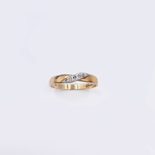 579 - Star Lot : A nine carat gold twist set diamond ring. Diamond marked to band. Ring size - Q. Weight -... 