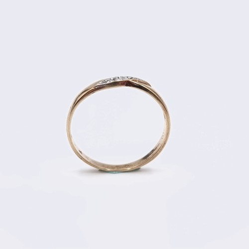 579 - Star Lot : A nine carat gold twist set diamond ring. Diamond marked to band. Ring size - Q. Weight -... 