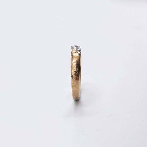 579 - Star Lot : A nine carat gold twist set diamond ring. Diamond marked to band. Ring size - Q. Weight -... 