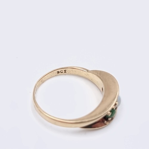 581 - Star Lot : A nine carat gold opal and jade ring. Size - M. Weight - 3.2 grams. Boxed.