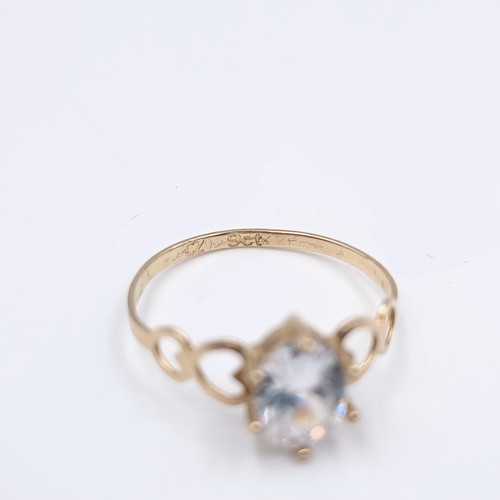 582 - An attractive Zircon stone ring with heart shaped mount set in nine carat gold. Ring size - Q. Weigh... 