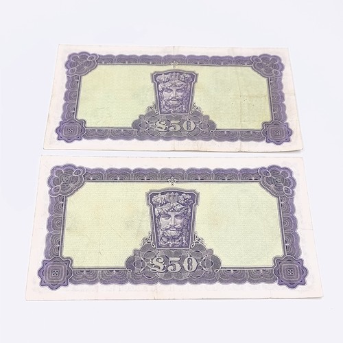 612 - Star Lot : Two Lady Lavery 50 pound bank notes both dated 4.4.77. (One with ink writing). Graded fin... 