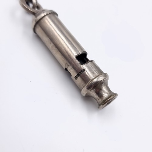 625 - An Acme Whistle with a sterling silver suspension T bar chain, With an alter sports whistle.