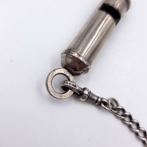 625 - An Acme Whistle with a sterling silver suspension T bar chain, With an alter sports whistle.