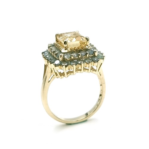 1 - Star Lot : A nine carat gold citrine stone ring set with Alexandrite surround. Size - O. Weight - 5.... 