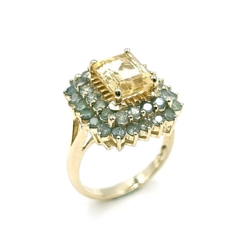 1 - Star Lot : A nine carat gold citrine stone ring set with Alexandrite surround. Size - O. Weight - 5.... 