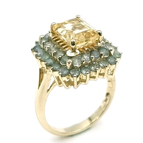 1 - Star Lot : A nine carat gold citrine stone ring set with Alexandrite surround. Size - O. Weight - 5.... 