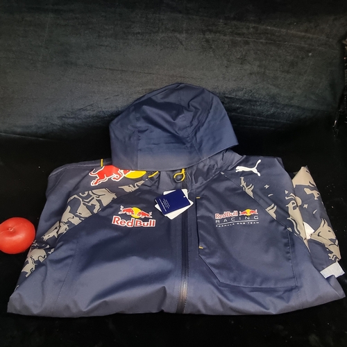 149 - A Puma Red Bull Racing F1 team rain jacket. Brand new with tags. Size L.