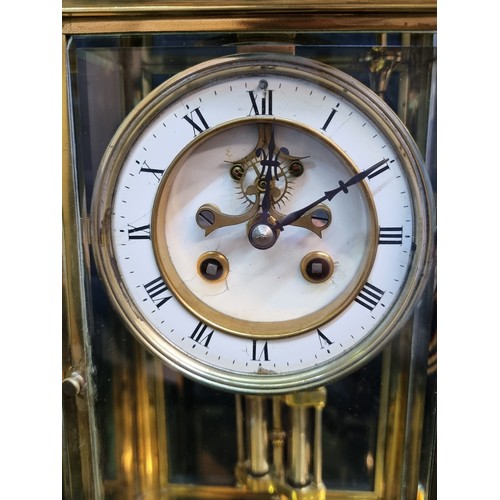 126 - Star Lot : A stunning large Edwardian brass and glass cased tall mantle clock featuring white enamel... 