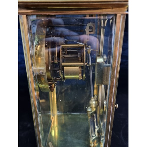 126 - Star Lot : A stunning large Edwardian brass and glass cased tall mantle clock featuring white enamel... 