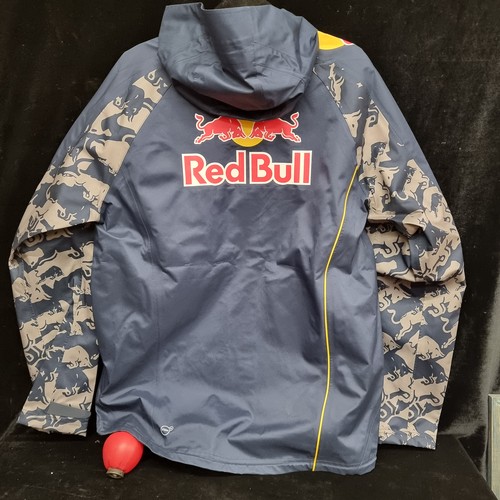 149 - A Puma Red Bull Racing F1 team rain jacket. Brand new with tags. Size L.