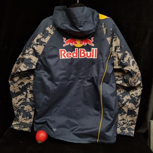 149 - A Puma Red Bull Racing F1 team rain jacket. Brand new with tags. Size L.