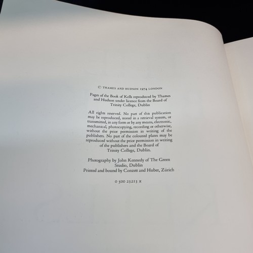 165 - A vintage hardback book copy of The Book of Kells. Features gilt embossed cloth cover and slip.