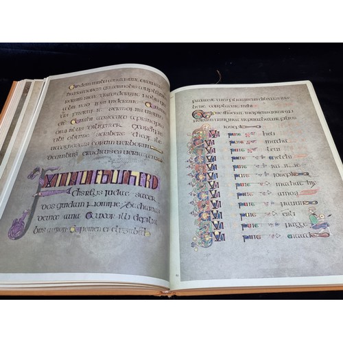 165 - A vintage hardback book copy of The Book of Kells. Features gilt embossed cloth cover and slip.